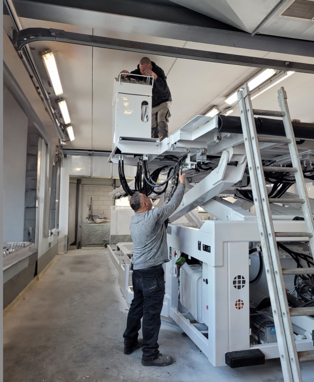 Aviaco GSE technicians servicing a ground support vehicle inside the maintenance workshop.