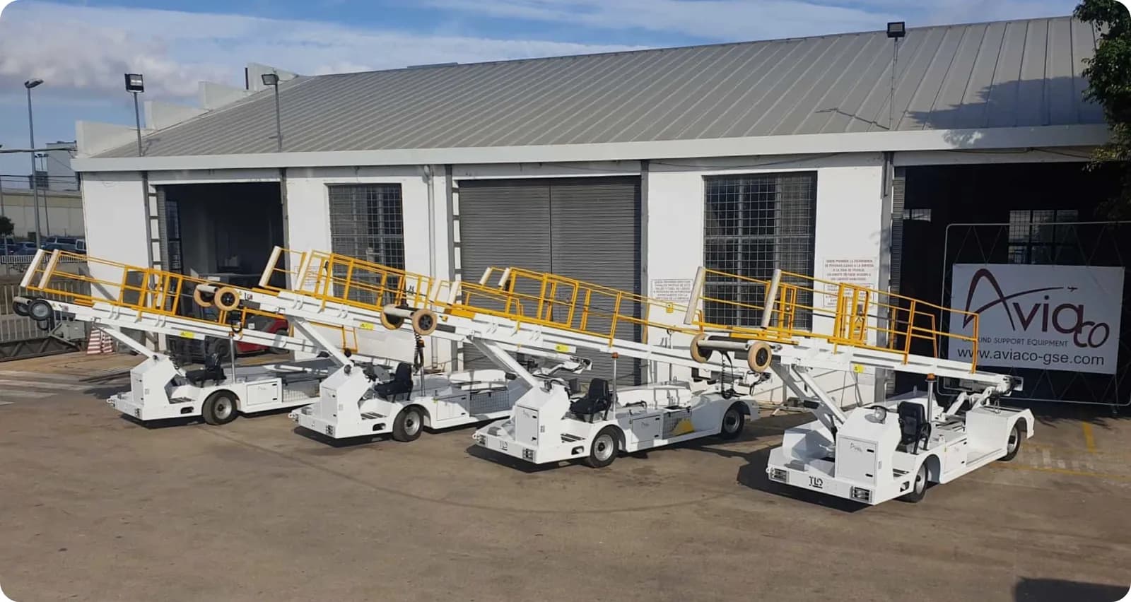 Aviaco belt loaders lined up outside the Aviaco GSE workshop